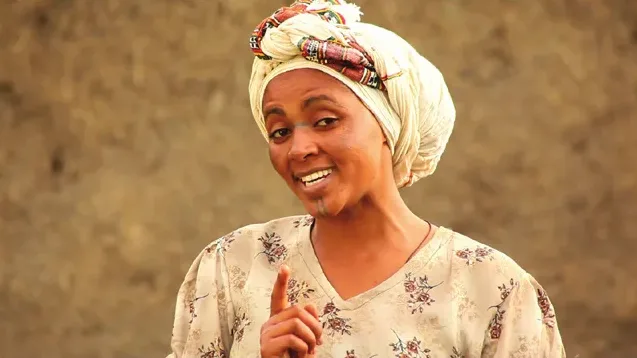 Video still: a woman speaking to camera in an ICM public service announcement
